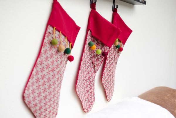 Pom Pom stockings hung with command hooks